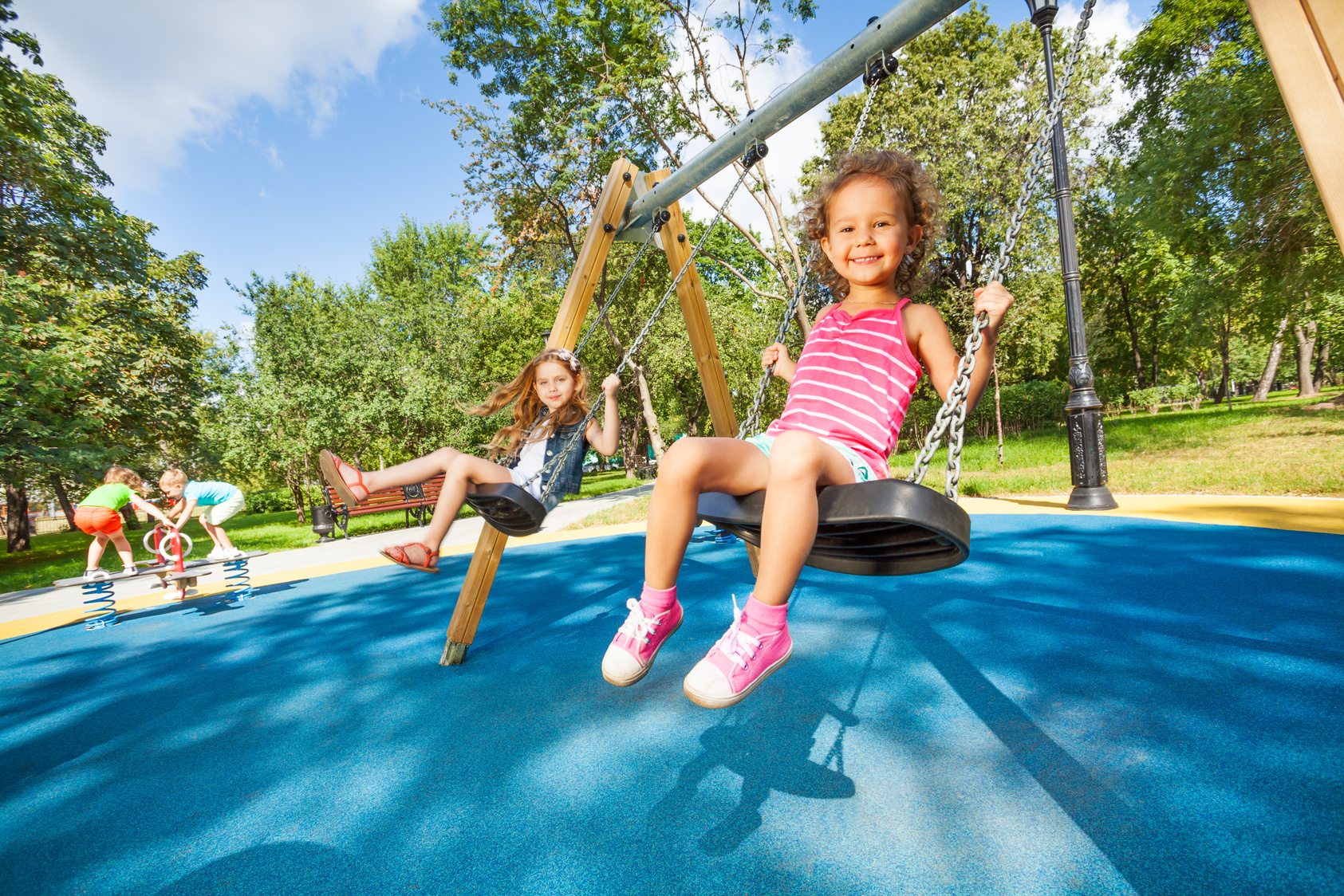 Kids swing on playground